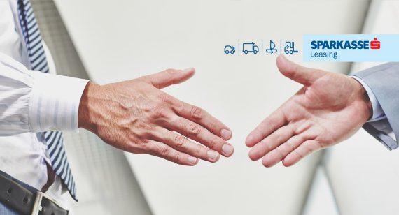 United business Two businessmen handshaking in office after signing contract